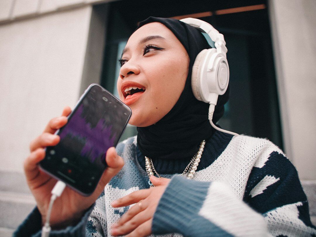 person listening to podcast on phone